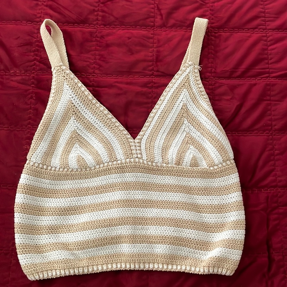 Beige and white knit crop top.